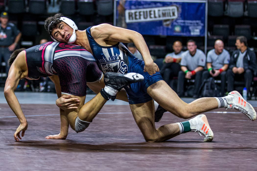 Andres Garcia of Spring Valley, right, tries to pin Nathaniel Rodriguez of Cimarron-Memorial ...