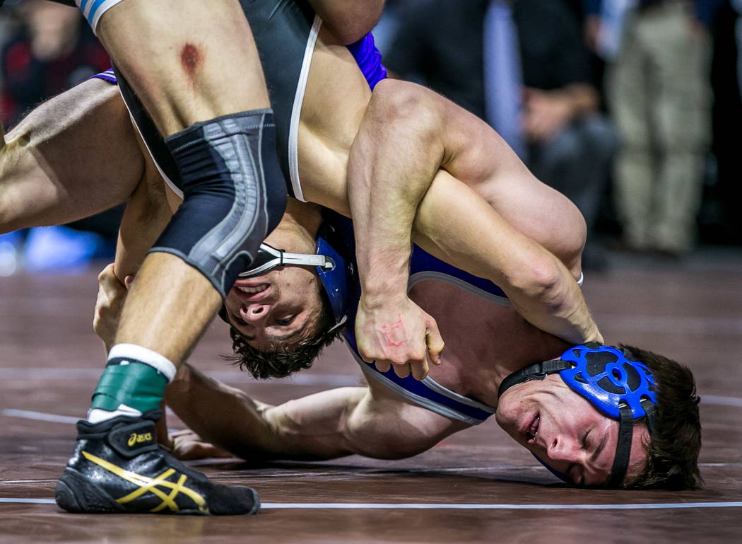 Nico Antuna of Centennial, left, wrestles with Werner Hunter of Spanish springs in the 4A 13 ...