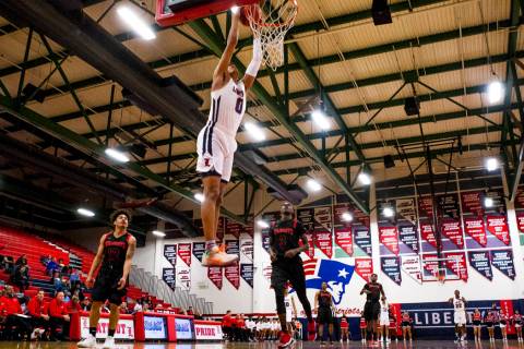 Liberty’s Julian Strawther (0) dunks while playing against Las Vegas at Liberty High S ...