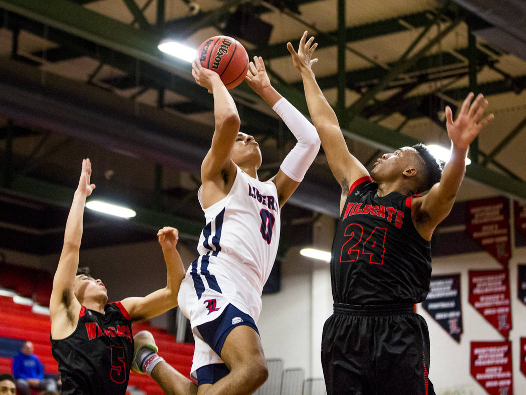 Liberty’s Julian Strawther (0) goes up for a shot against Las Vegas defenders Zack Mat ...