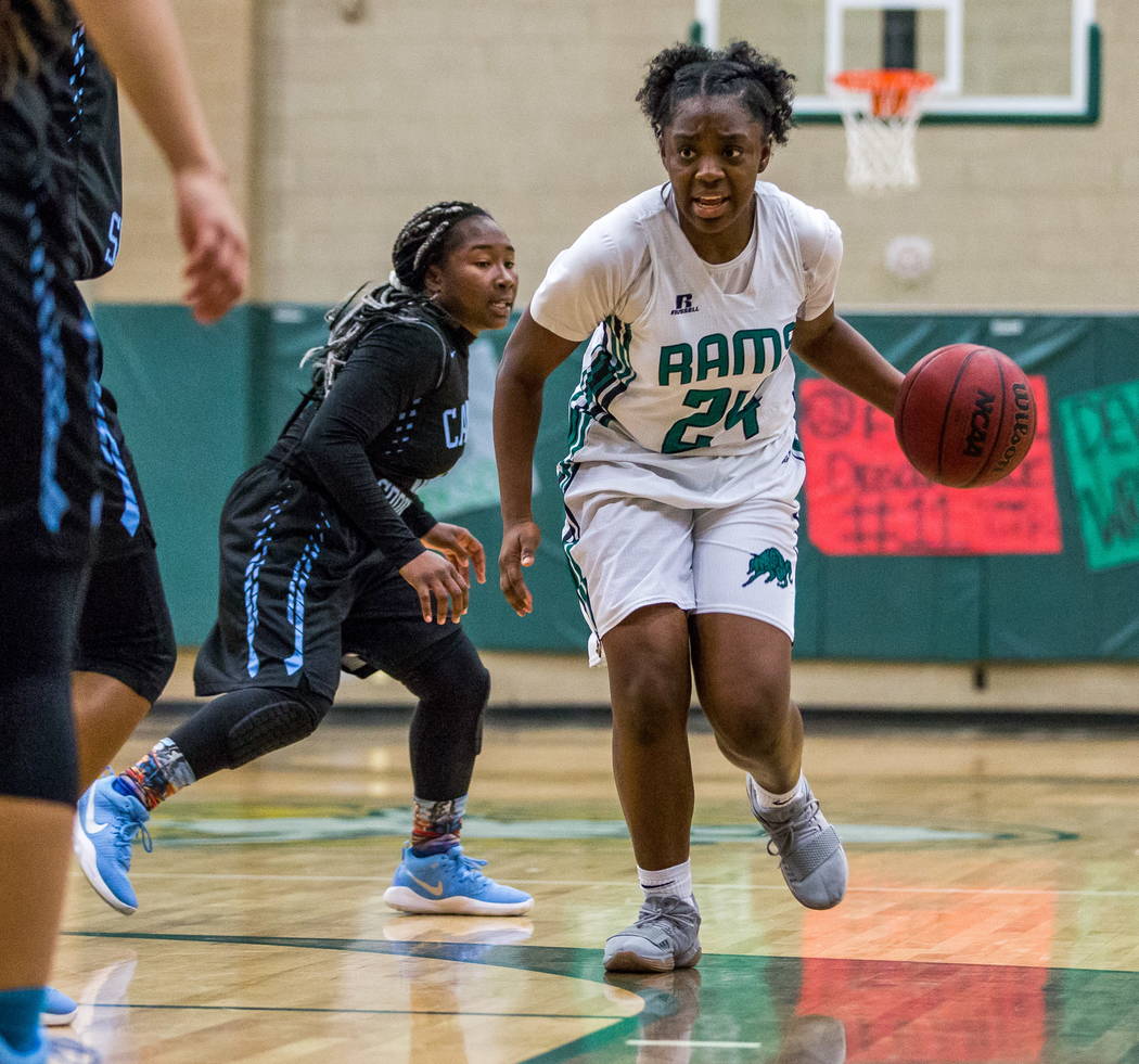 Rancho’s Kyndal Ricks (24) takes the ball down the court while Canyon Springs’ K ...