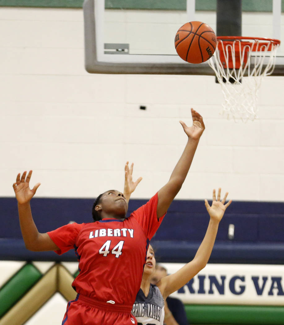 Liberty High’s Dre’una Edwards (44) shoots against Spring Valley during a girl&# ...