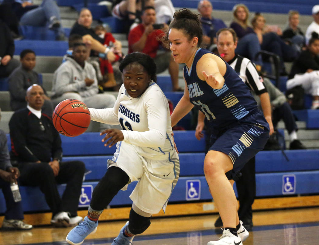 Canyon Springs’ Ke’Ajanae Haley (13) dribbles around Foothill’s Bri Rosale ...