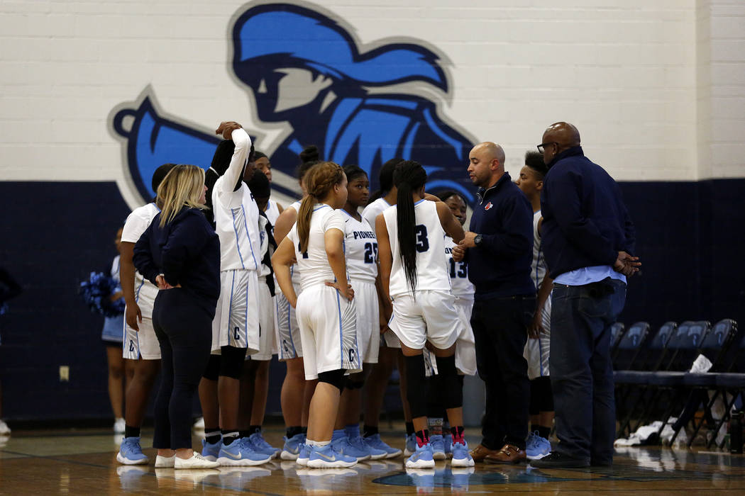The Canyon Springs girls basketball team gathers for a time out during the Sunrise Region se ...