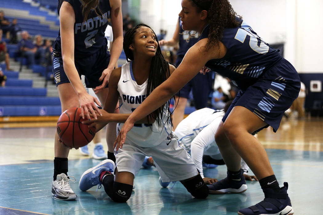 Canyon Springs’ Iyani Hayden (23) fights for the ball against Foothill during the Sunr ...