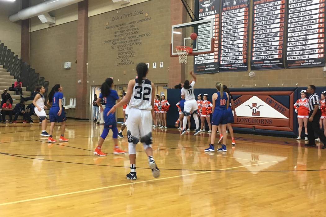 Spring Valley’s Kayla Harris (11) goes up for a shot in a Sunset Region semifinal game ...