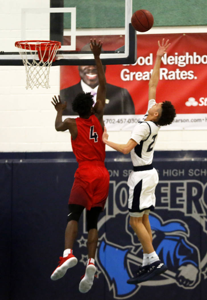 Foothill’s Jace Roquemore (22) shoot against Coronado’s Tahj Comeaux (4) during ...