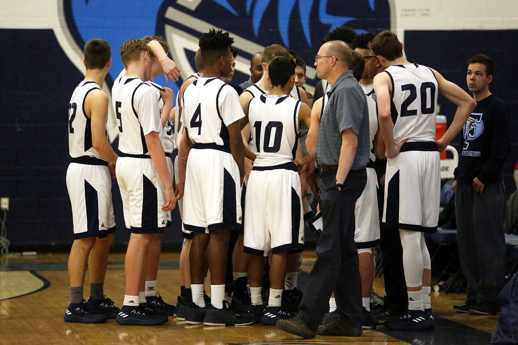 Foothill boys basketball team gathers for time out during the Sunrise Region semifinals at C ...