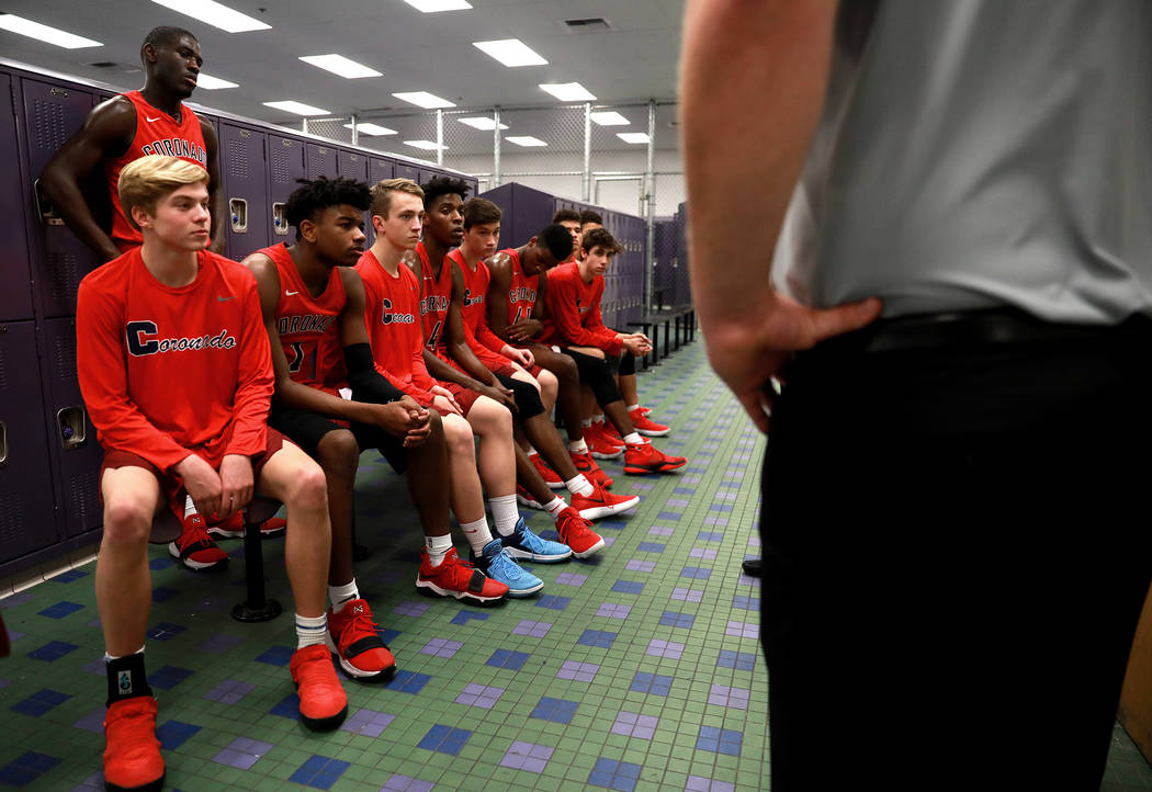Coronado boys basketball team talks in the locker room during the Sunrise Region semifinals ...