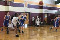 The Needles girls basketball team moves the ball up the court against Democracy Prep in thei ...