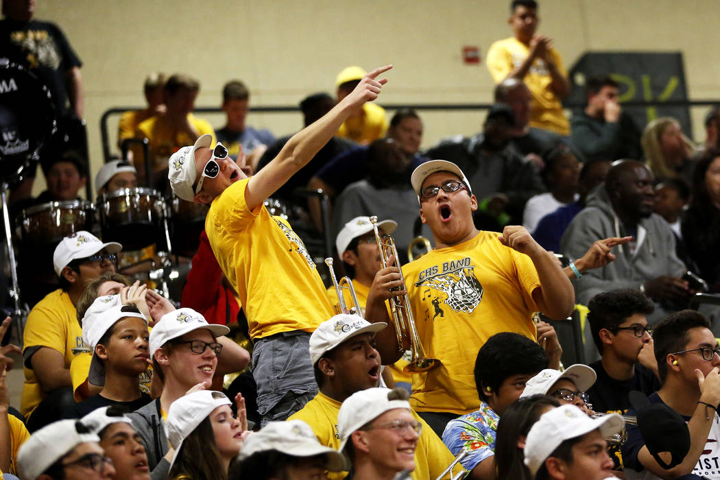Fans cheer during the Sunset Region boys basketball championship at Legacy High School in No ...