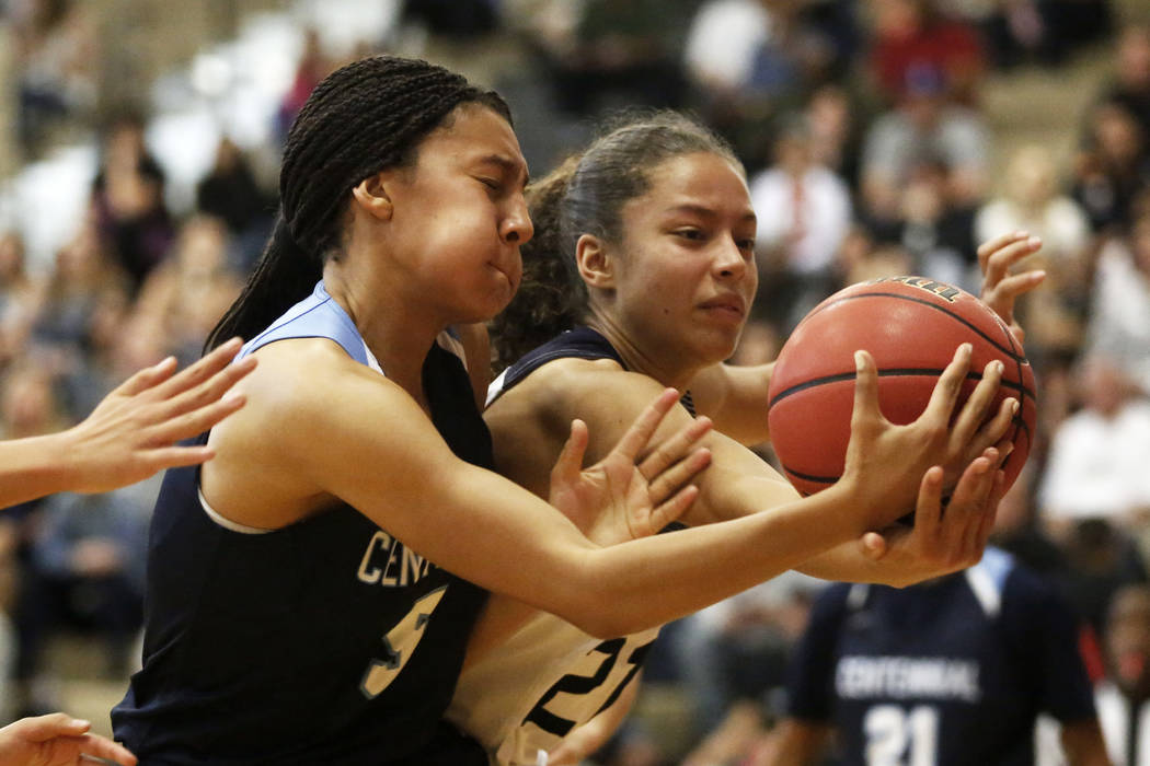 Centennial’s Jade Thomas (5) and Spring Valley’s Ella Zanders (21) reach for the ...