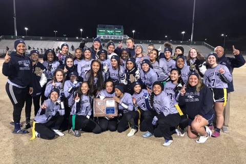 The Shadow Ridge flag football team poses with the Sunset Region championship trophy after b ...