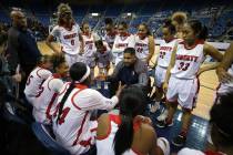 Liberty’s head coach Chad Kapanui talks to his team during the NIAA state basketball t ...