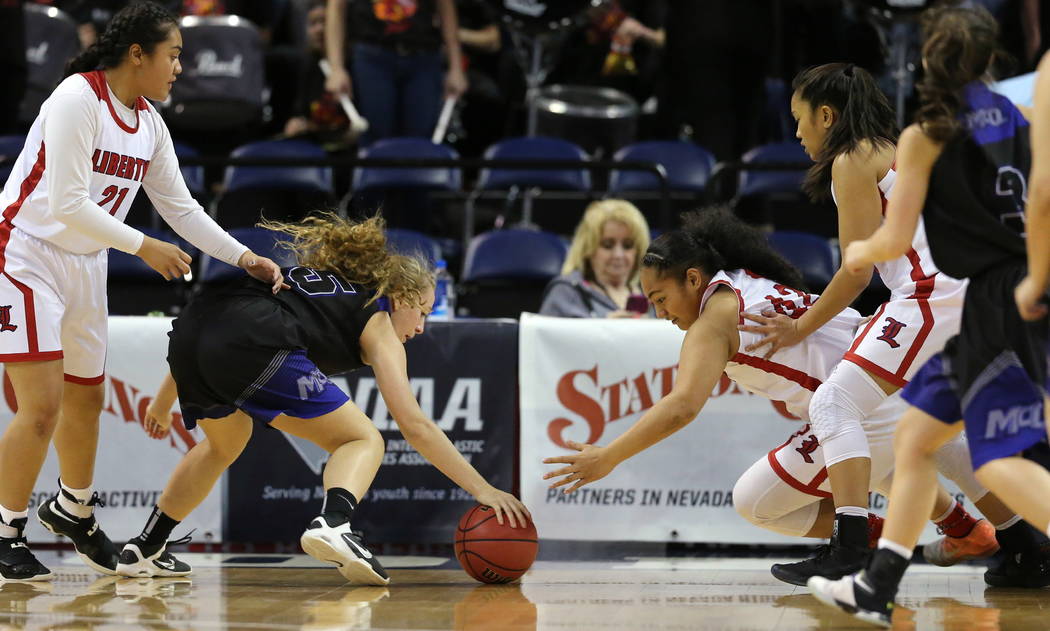 Liberty’s Alapese Matauti, right, and McQueen’s Mackenzie Corkill reach for a l ...