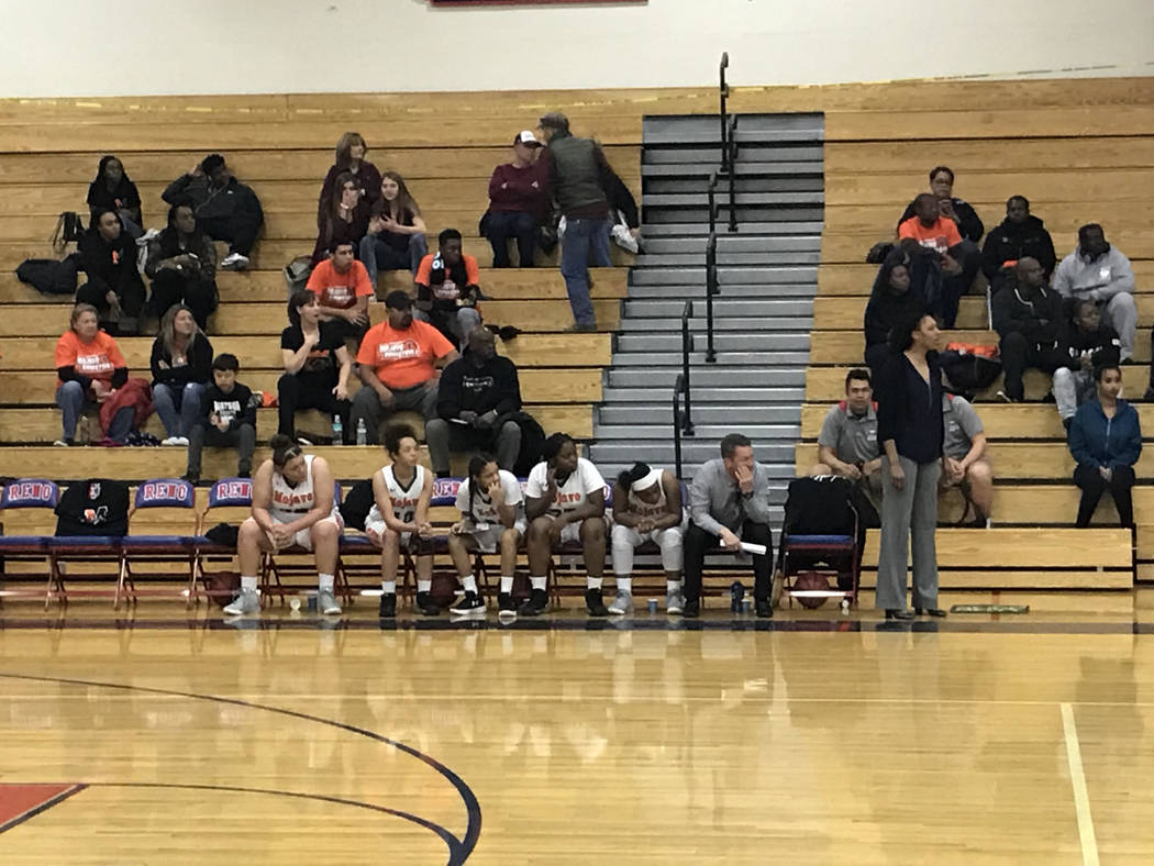 Mojave players watch from the bench in the second half of the Rattlers’ 73-38 loss to ...