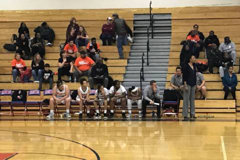 Mojave players watch from the bench in the second half of the Rattlers’ 73-38 loss to ...