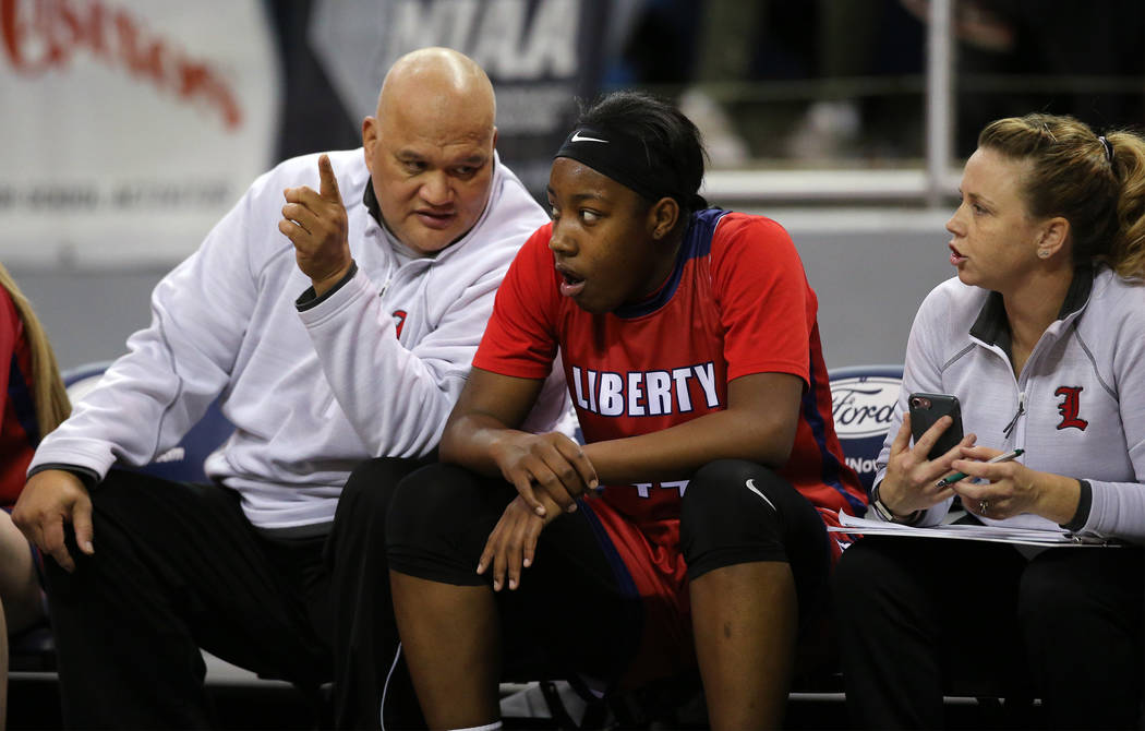Liberty’s Dre’una Edwards talks with assistant coaches during the NIAA state b ...
