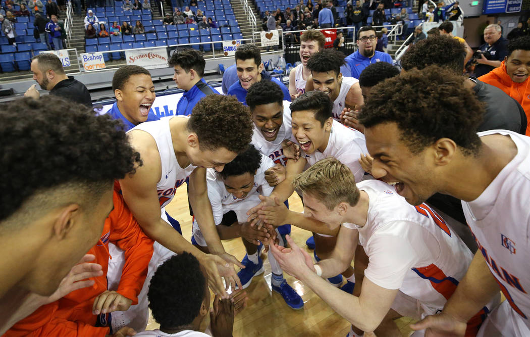 Bishop Gorman celebrates after defeating Bishop Manogue 62-41 for the 4A NIAA state basketba ...