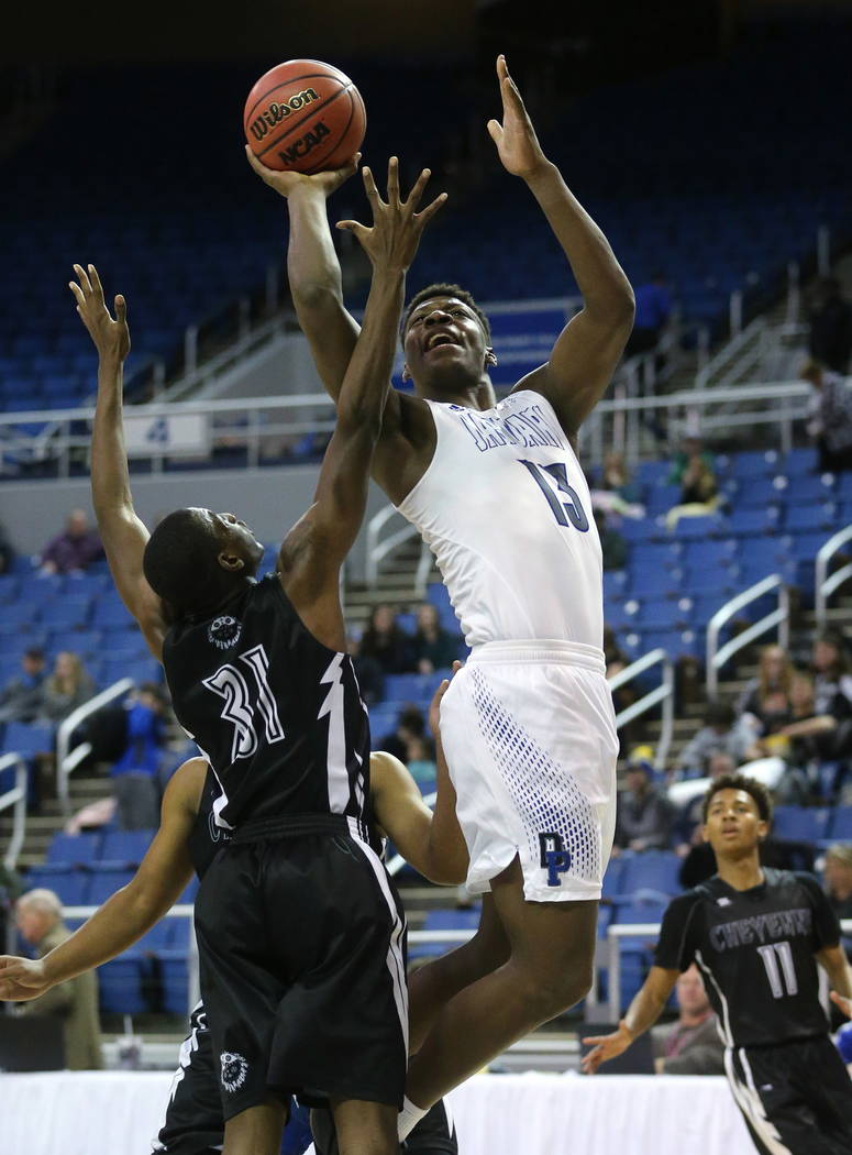 Desert Pines’ Darnell Washington shoots over Cheyenne’s Hahsonie Laushaul during ...