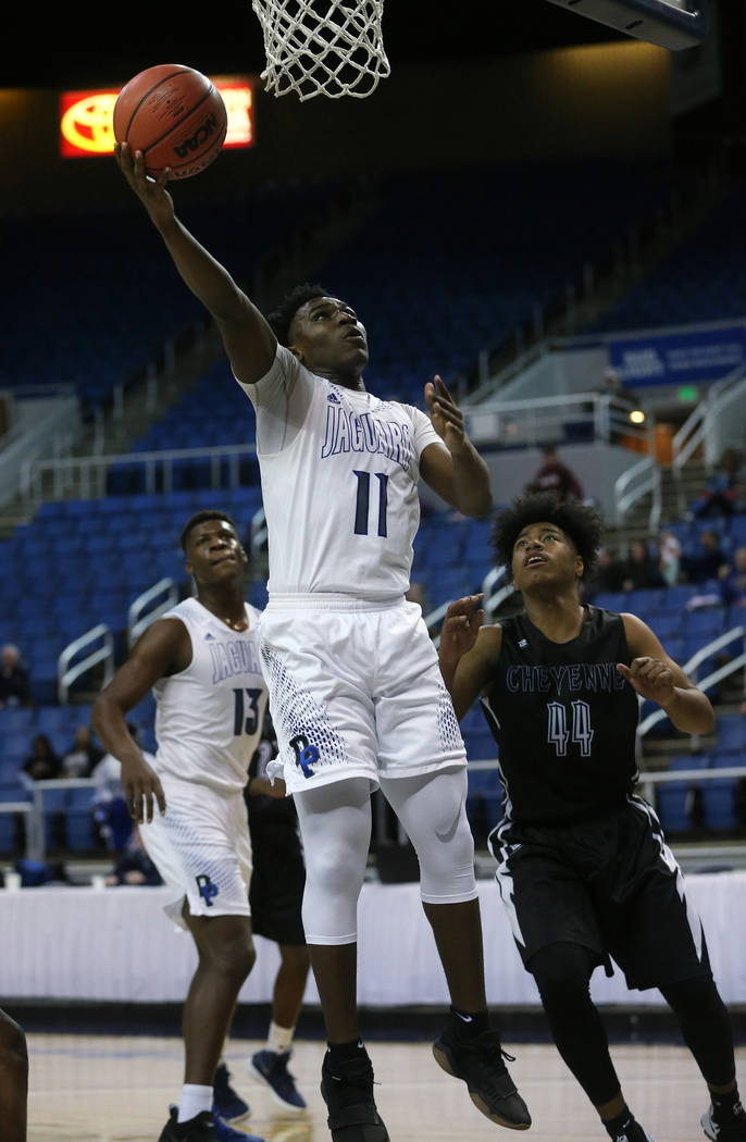 Desert Pines’ Darius Mitchell shoots in the NIAA 3A state basketball championship game ...