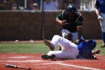 Basic’s Trace Evans (18) slides into home base to score a run as Rancho’s Miguel ...