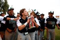 Rancho Rams’ Joseph Walls (14) and Carlos Hernandez (25) kiss the trophy after beating ...