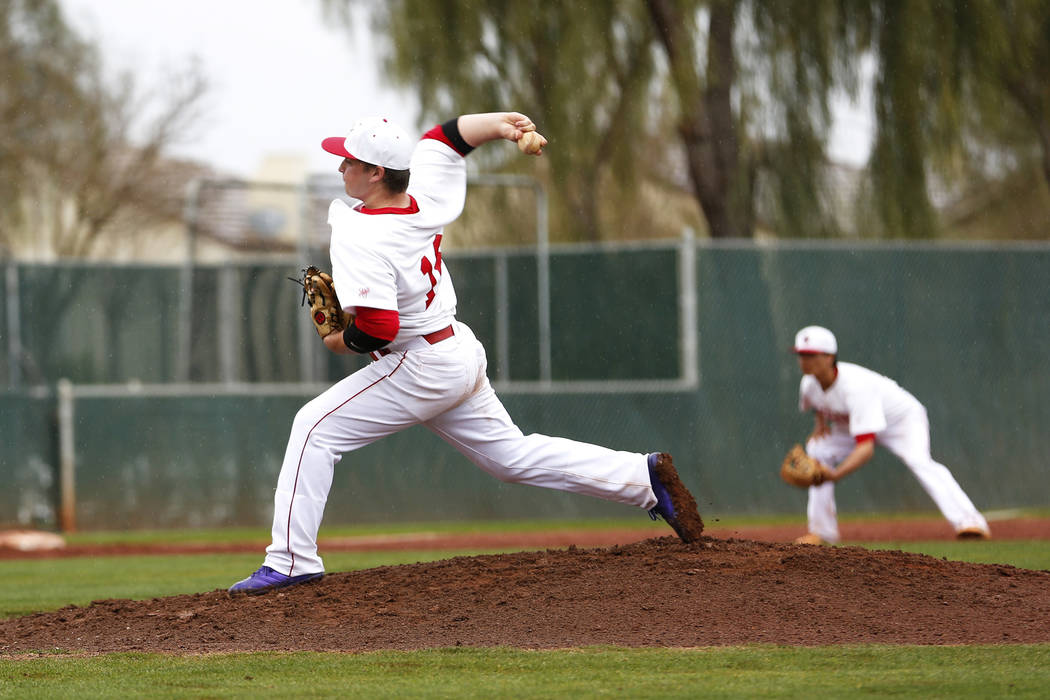 Arbor View Aggies’ Connor Strong (18) pitches against the Rancho Rams at Desert Oasis ...