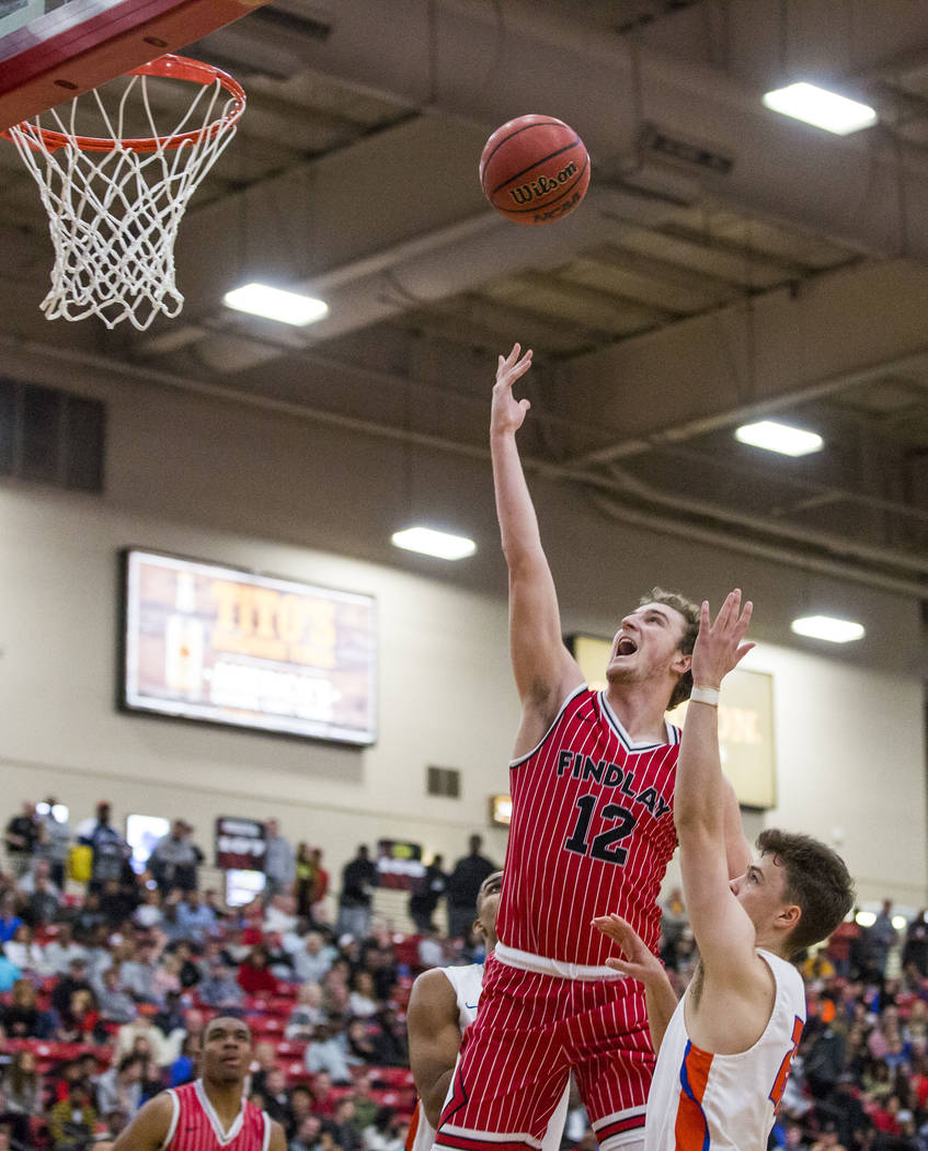 Findlay Prep’s Jack Schwietz (12) lays up while Bishop Gorman’s Chance Michels ( ...