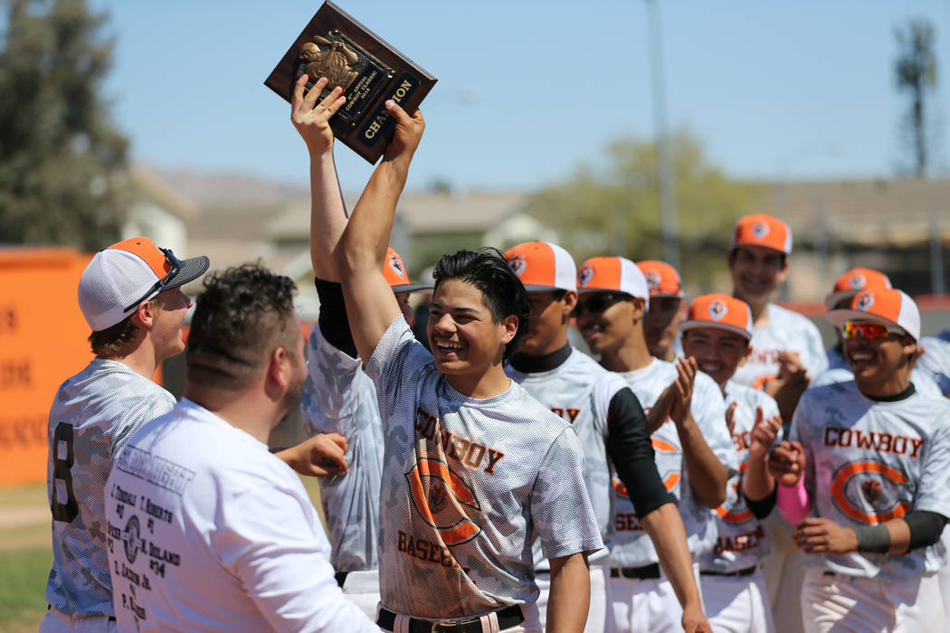 Chaparral’s Robert O’Connor (21) holds up a first place plaque after winning 4-2 ...