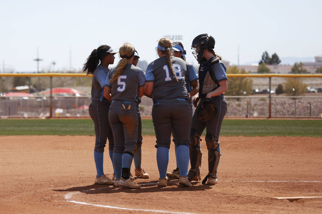 Centennial High School’s softball team gathers at the mound during the Spring Jamboree ...