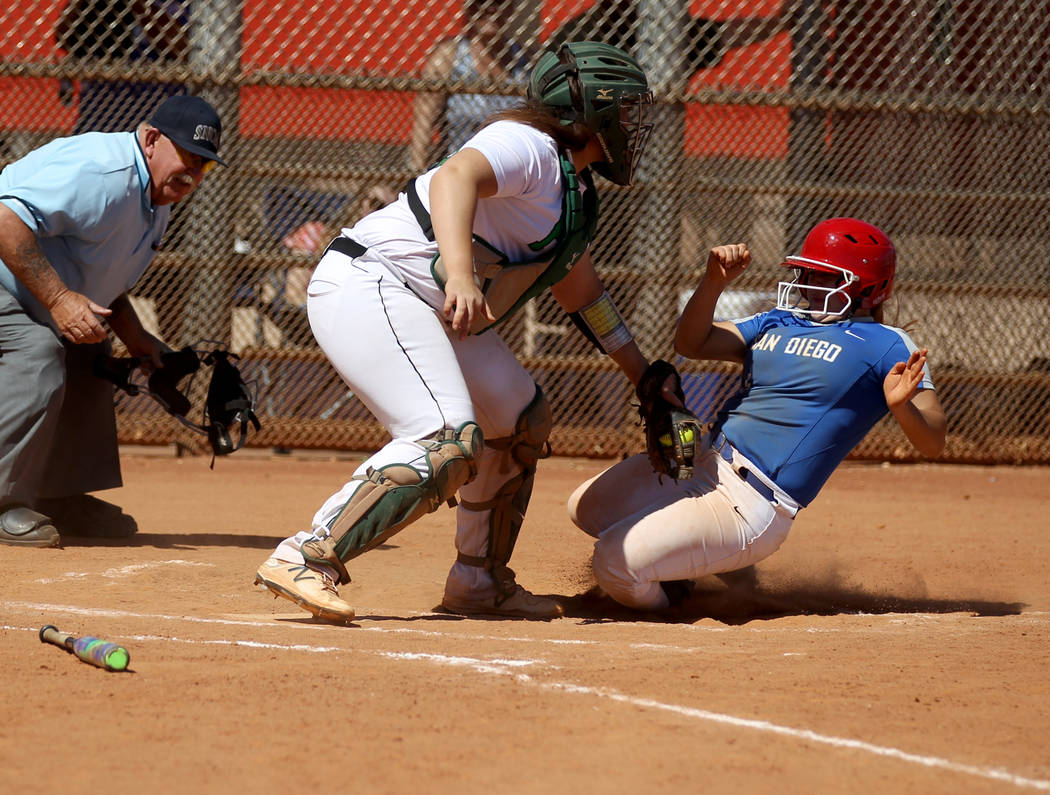 Palo Verde catcher Grace Chavez tags out Isabella Gilbreth of San Diego in the second inning ...