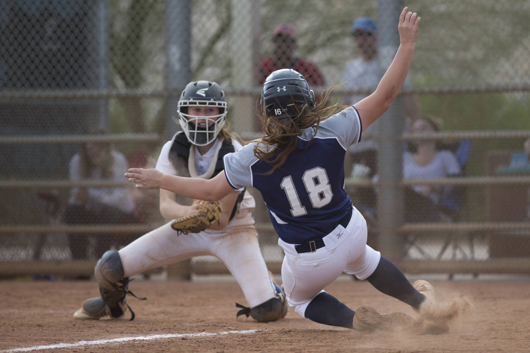 Shadow Ridge’s Tori Nichols (18) slides home late for an out against El Camino Real du ...