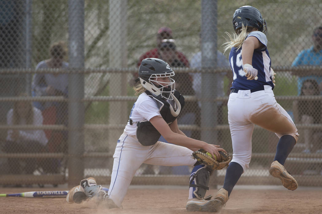 Shadow Ridge’s Mia Voges (15) runs home for a run against El Camino Real during the so ...