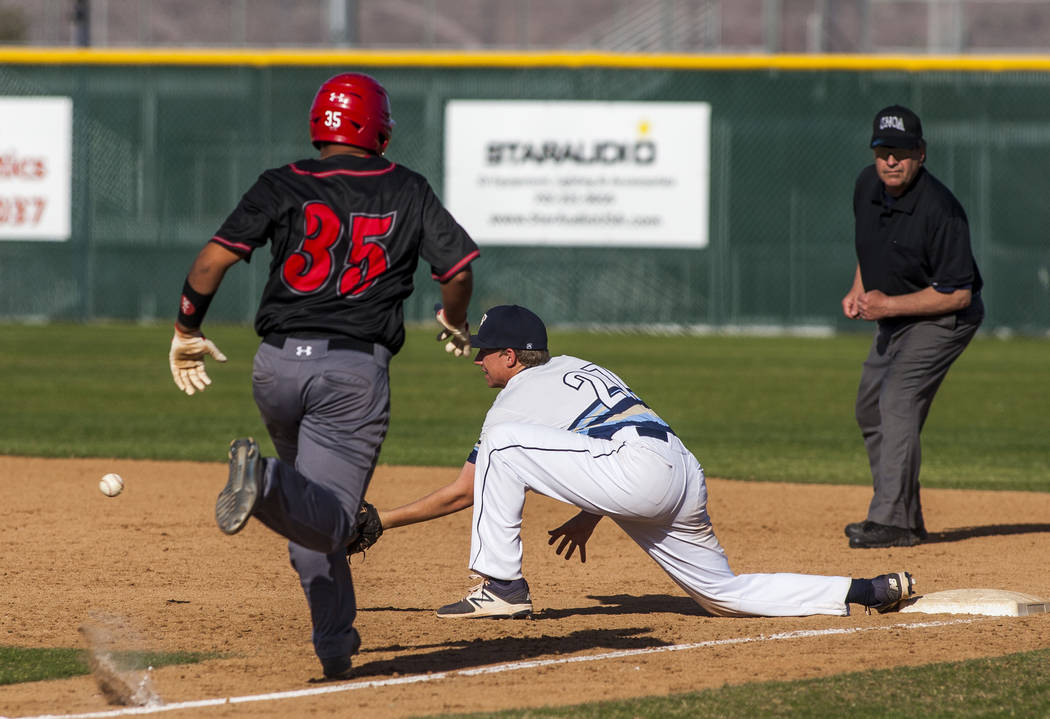 Foothill first baseman Tyler Kara prepares to catch a ball at first base to tag out Las Vega ...