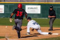 Foothill first baseman Tyler Kara prepares to catch a ball at first base to tag out Las Vega ...