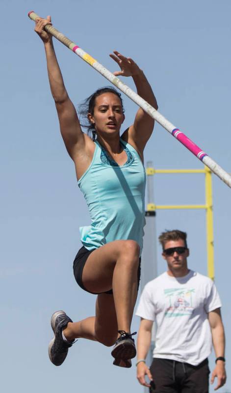 Gabby Carson, left, one of Nevada’s top prep pole vaulters, works on her technique dur ...