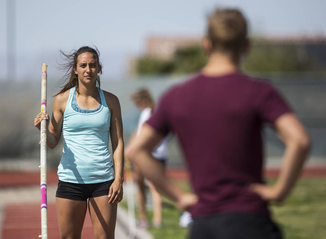 Gabby Carson, left, one of Nevada’s top prep pole vaulters, waits to make a jump durin ...