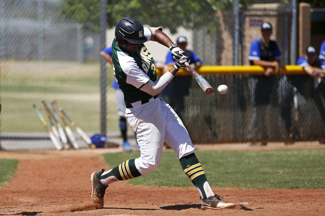 Rancho’s shortstop Edarian Williams (32) swings against Basic at Rancho High School in ...