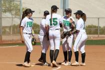 Palo Verde players gather on the mound in the first inning of their softball game against Sa ...