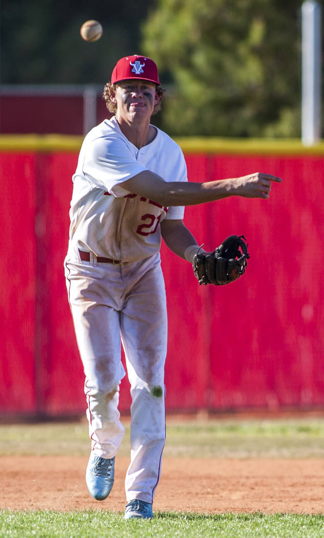 Arbor View infielder Austin Pfeifer looks for a play at first while playing against Faith Lu ...