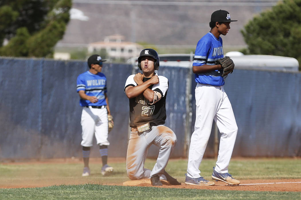 Rancho’s centerfielder Anthony Guzman (27) reacts after hitting a triple against Basic ...