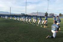 Centennial players stretch after their 11-6 home victory over Rancho in Las Vegas, Friday, M ...