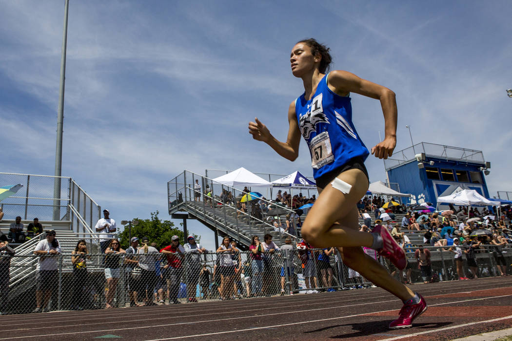 Basic junior Raquel Chavez runs in the 1,600-meter run, finishing first with a time of 5:26. ...