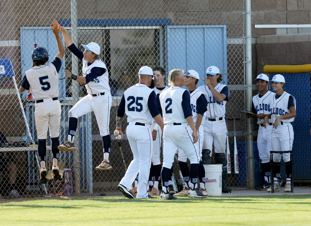 Centennial Zachary Hare (5) celebrates with his teammates scoring against Palo Verde in the ...