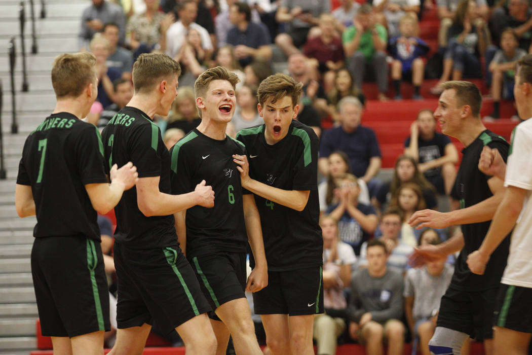 The Palo Verde High School volleyball team reacts after scoring against Centennial High Scho ...