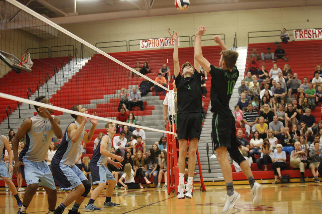 Palo Verde High School’s Jared Brady (10) preps the ball for teammate Cooper Jarman (4 ...