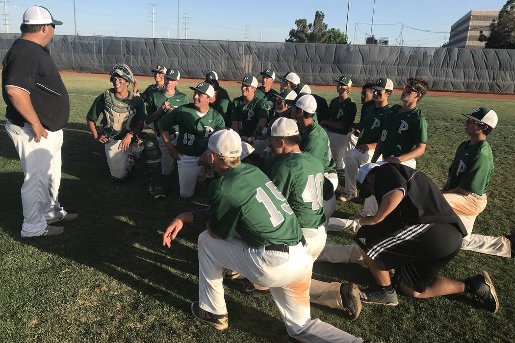 Palo Verde players meet with coach Joe Hallead after their 6-4 victory over Bishop Gorman in ...