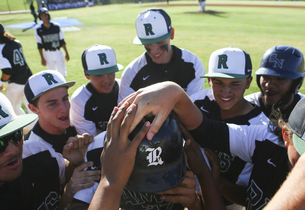 Rancho players celebrate a grand slam hit by Rancho’s Anthony Guzman during the Sunset ...