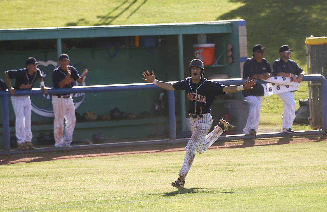 Coronado’s Joey Calvert (1) celebrates his run as he approaches home plate during the ...